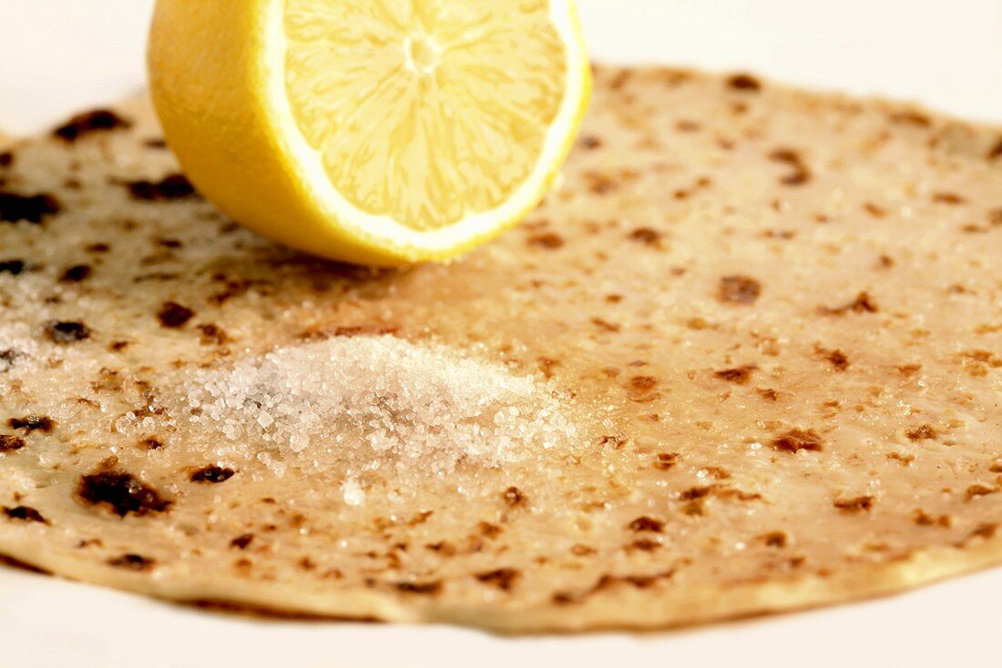 A pancake with sugar and lemon