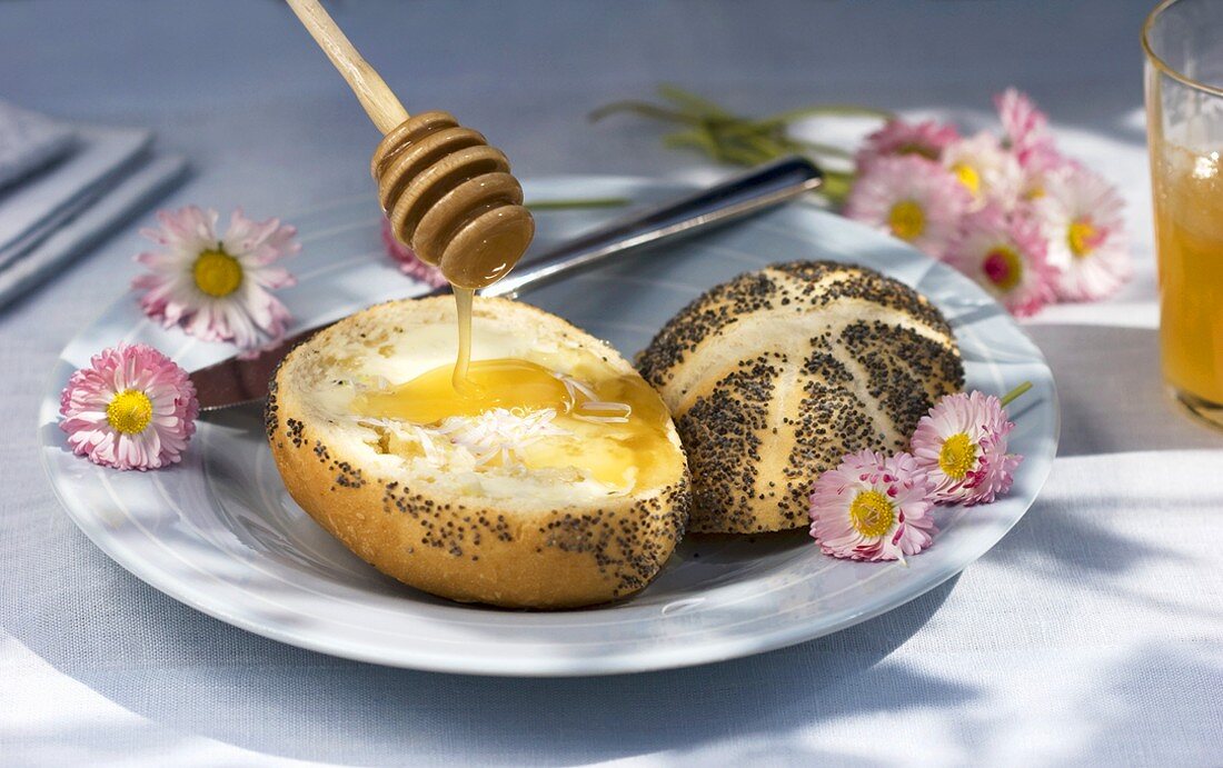 A poppy seed roll with honey