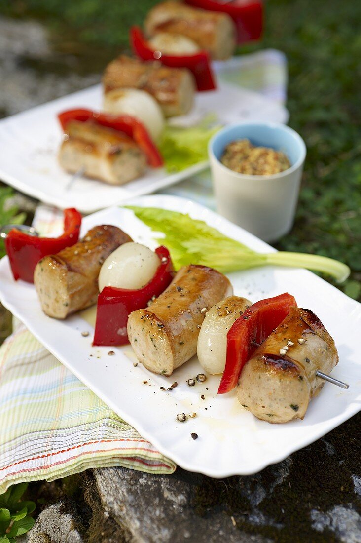 Grilled sausage kebabs with pepper and onion