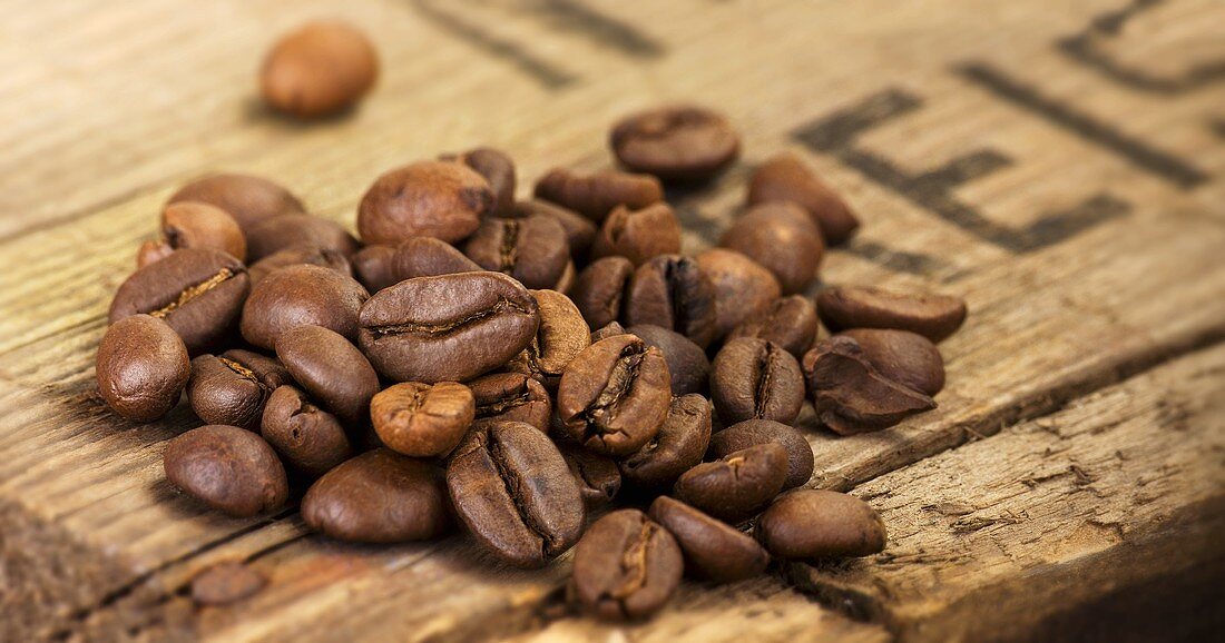 Coffee beans on a wooden board