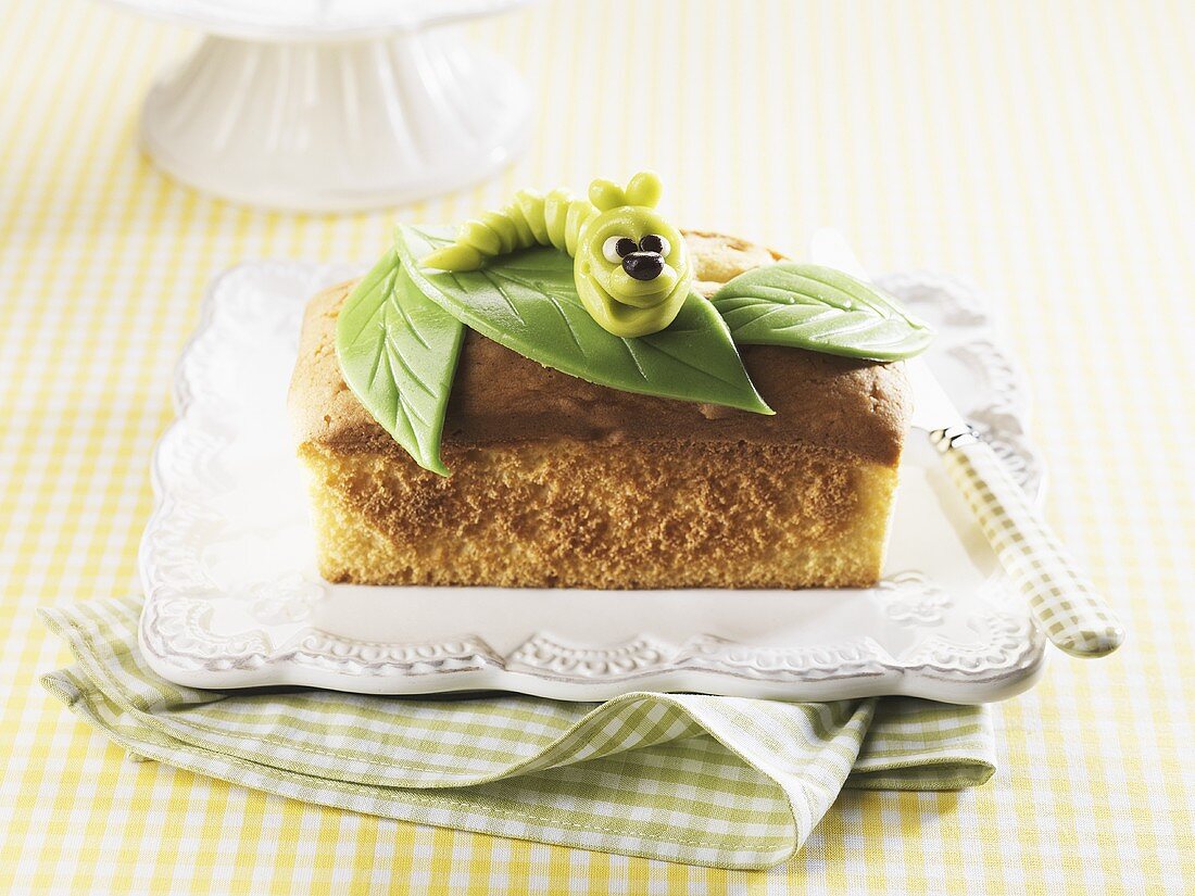 Butter cake decorated with a marzipan caterpiller