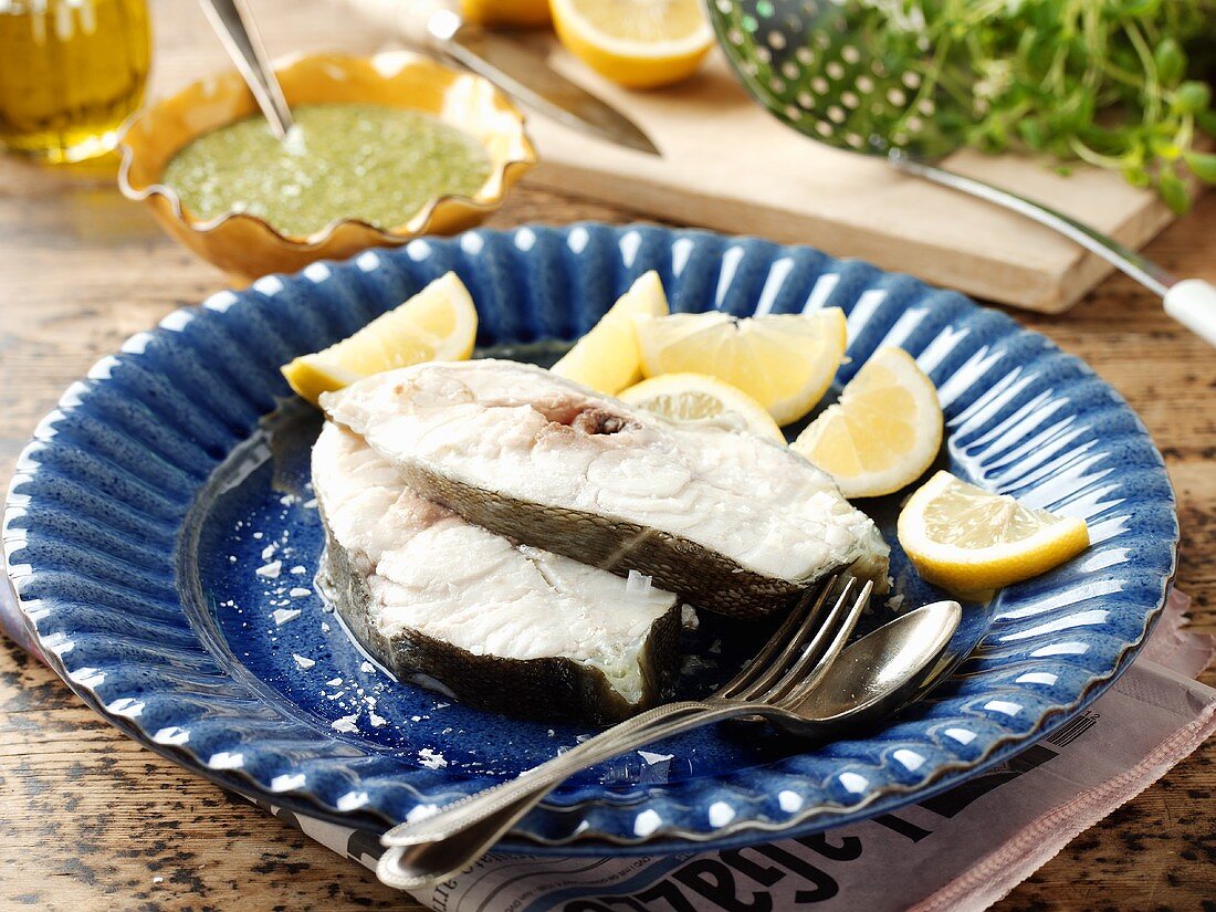 Poached cod steaks with lemon