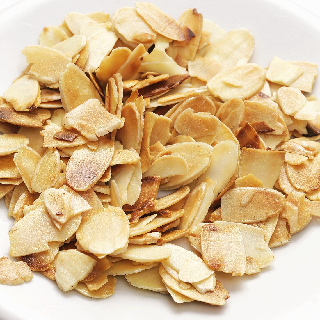 Toasted flaked almonds on a plate