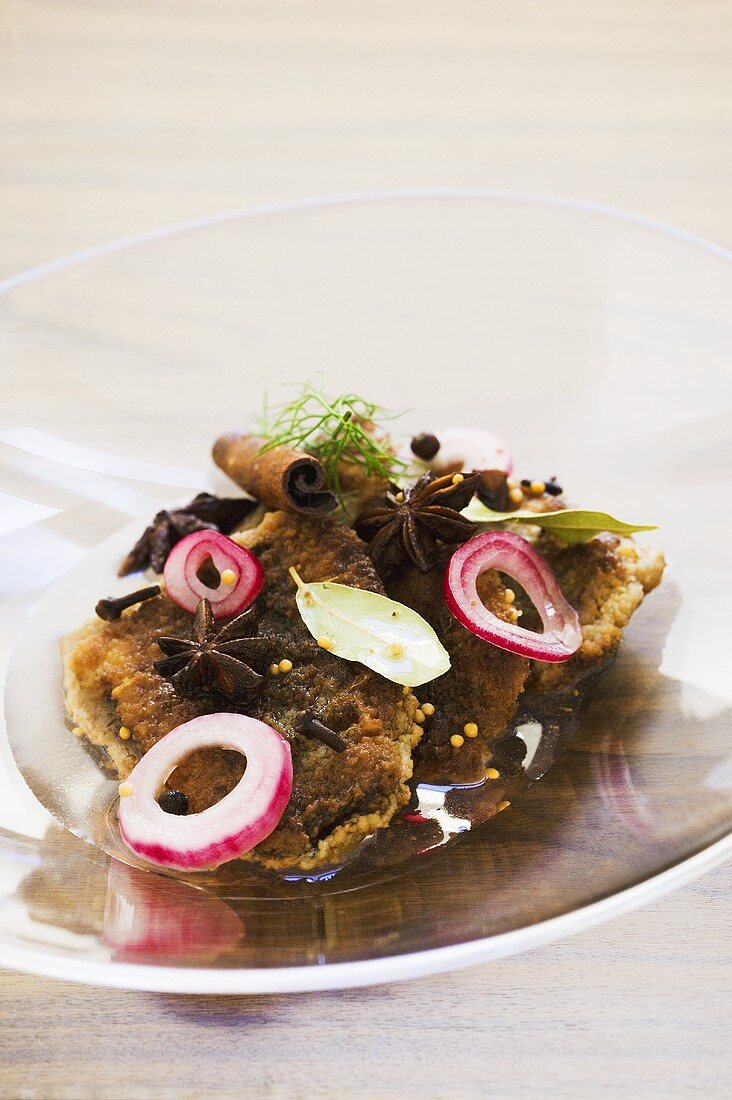 Pickled fried herrings with onions and spices