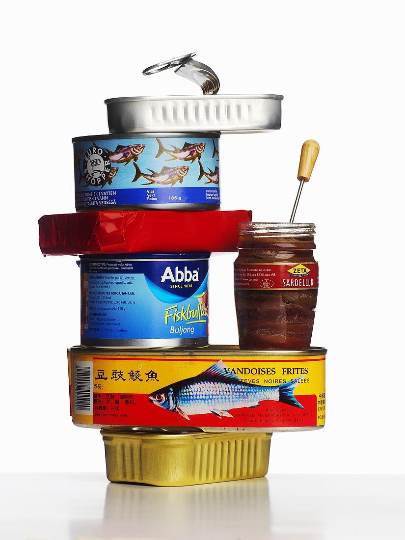 Various types of fish in tins and jar