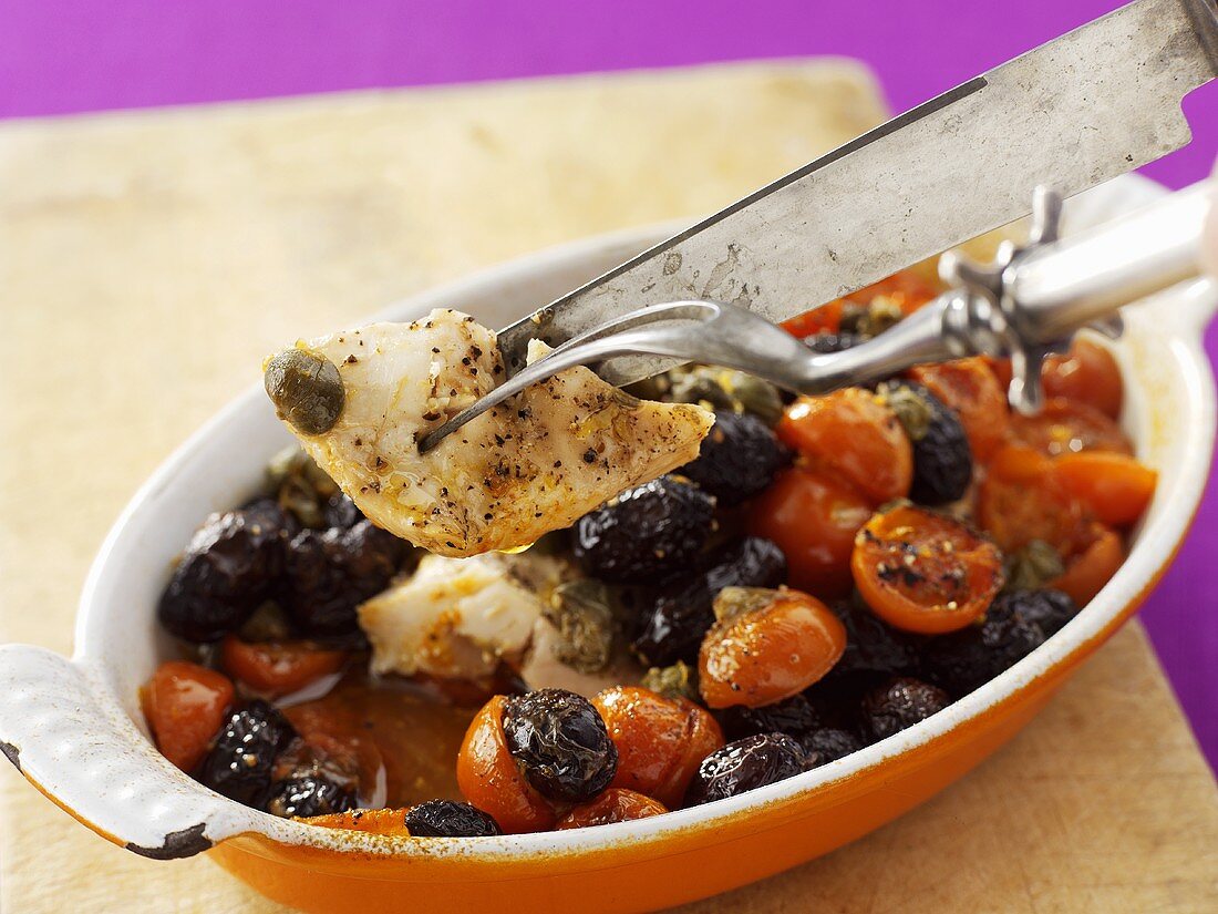 Baked chicken breast with tomatoes and olives