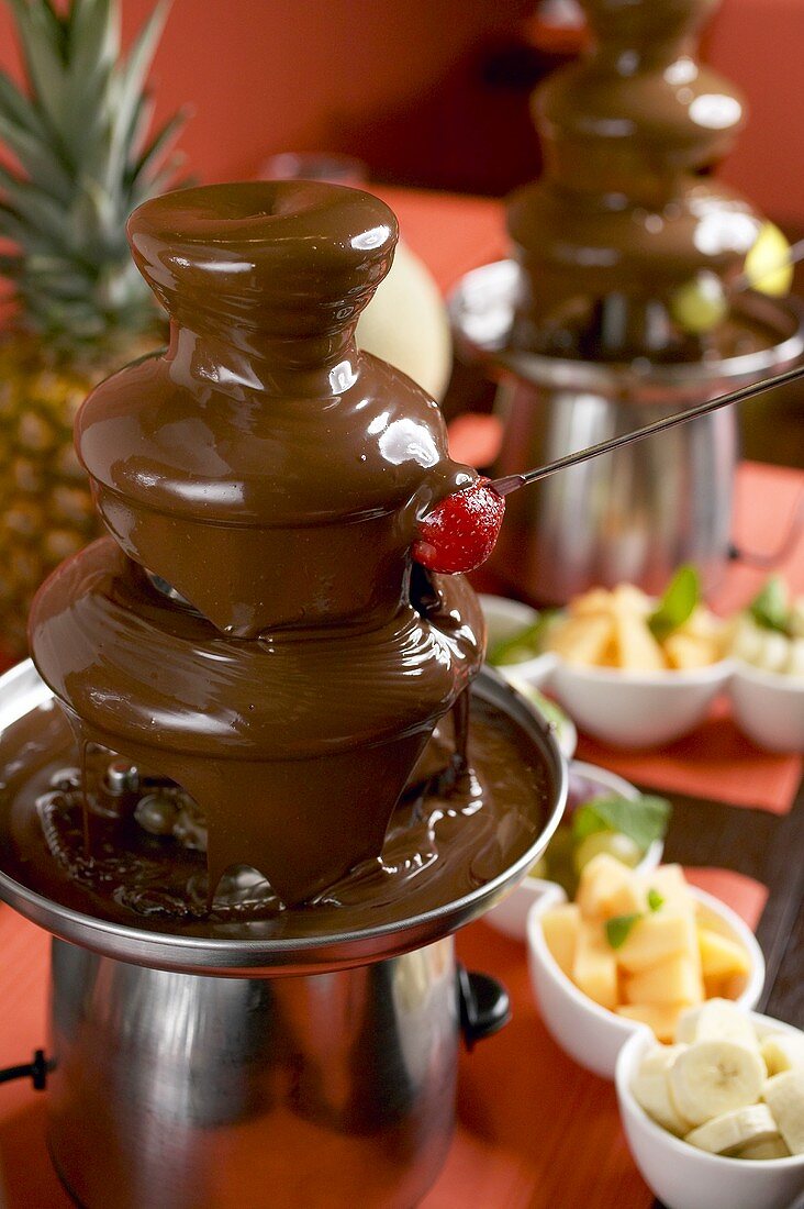 Chocolate fountain with fruit for dipping