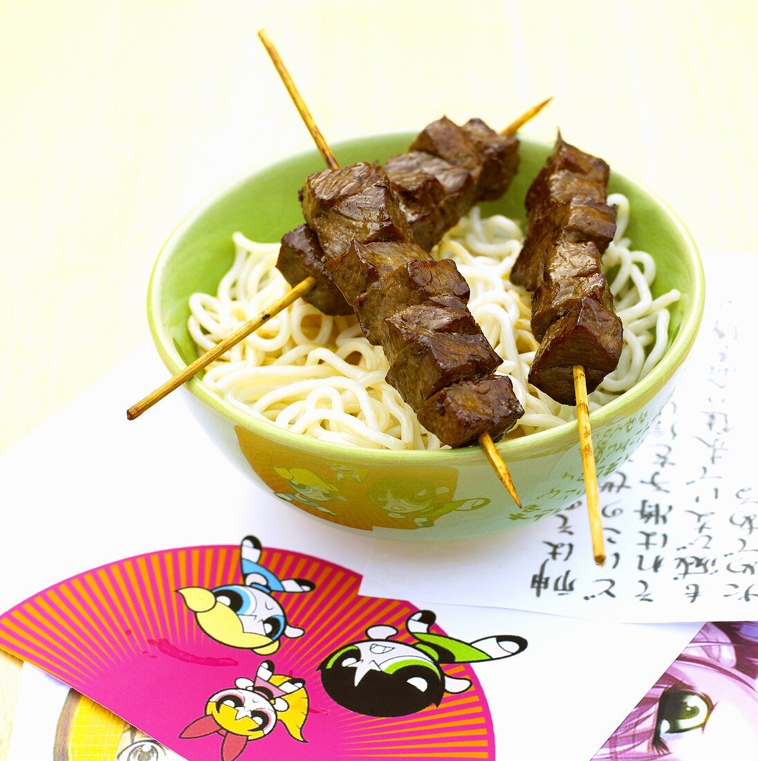Noodles with meat skewers