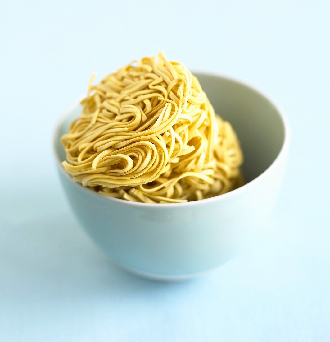 Noodle nest in a blue bowl