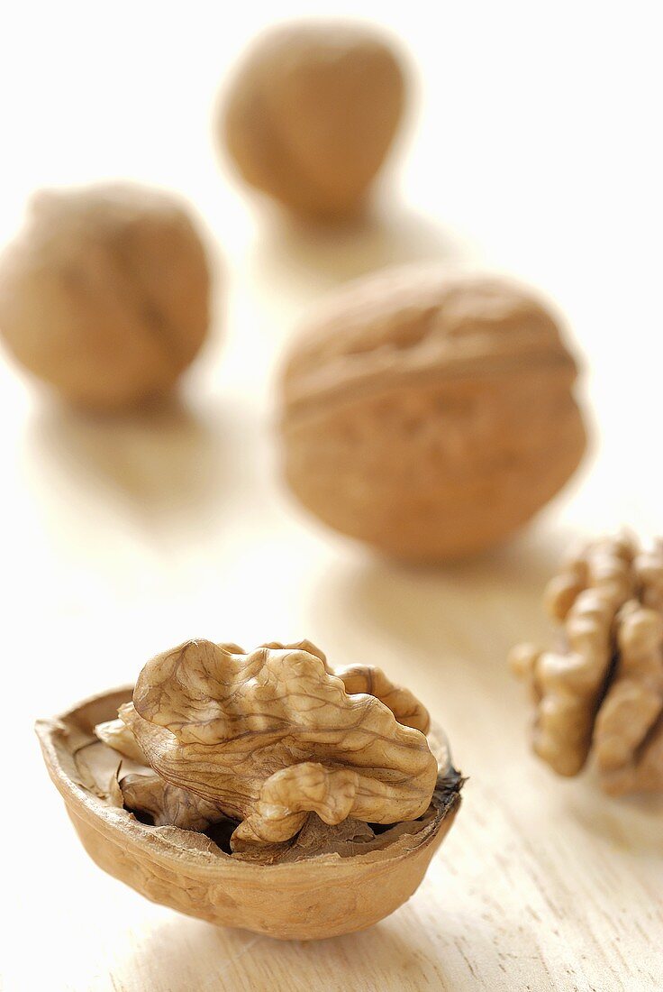 Half a walnut and unshelled walnuts