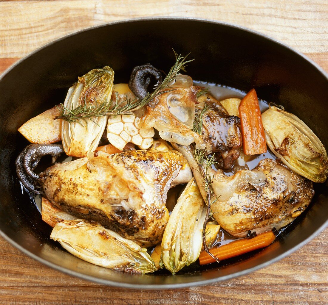 Pheasant with vegetables in braising pan