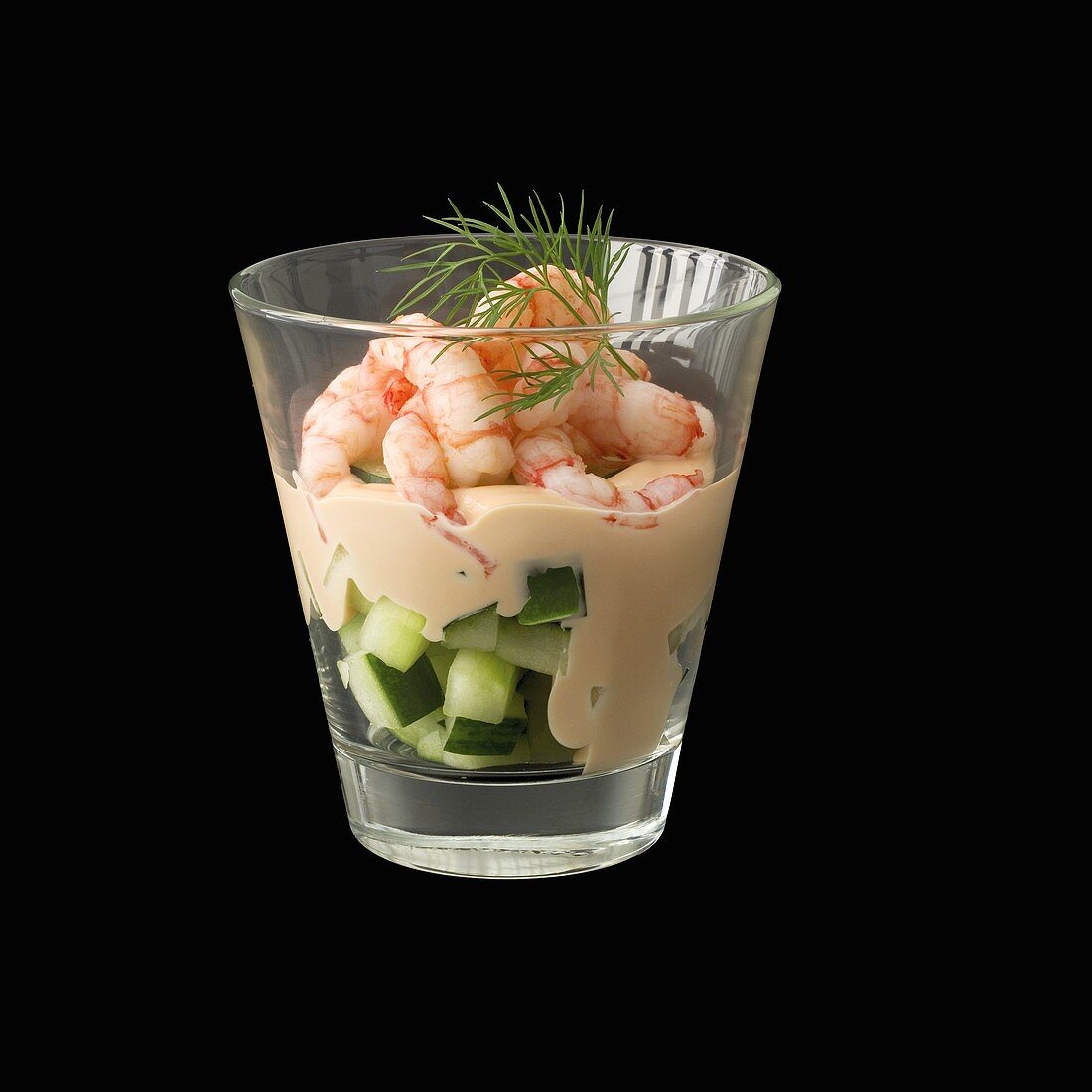 Shrimp cocktail on diced cucumber in glass