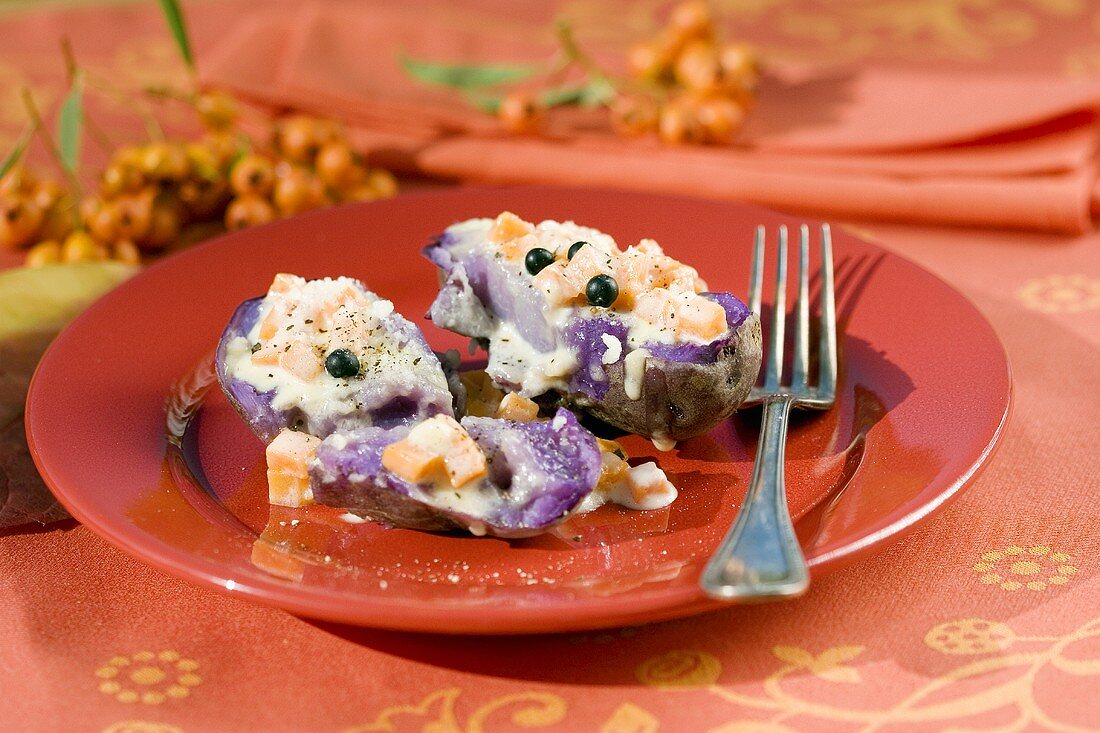 Baked purple potatoes with pumpkin and cheese filling