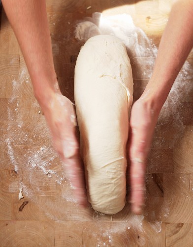 Kneading and Forming Bread Dough on a Floured Surface