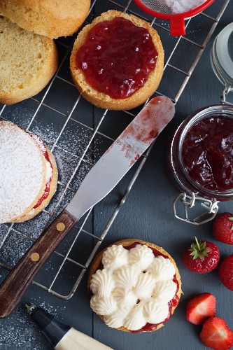 Mini Victoria Sponge cakes (sponge cake with vanilla buttercream and strawberry jam) being prepared