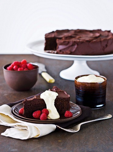Chocolate cake with cream and raspberries