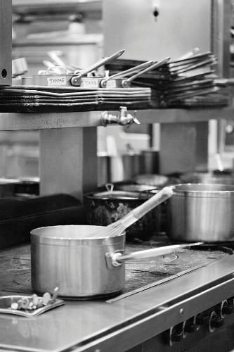 Black and White Commercial Kitchen Scene – License Images – 11228632 ❘ StockFood
