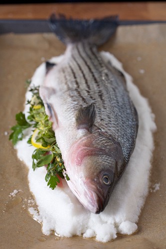 Preparing to Salt Roast a Whole Fish with Lemon and Herbs