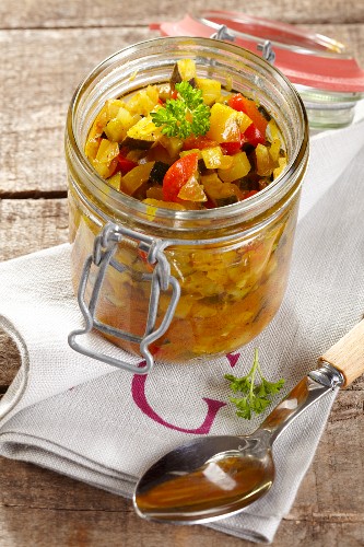 Courgette relish in a jar on a napkin