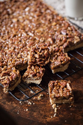 Pecan nut slices on a cooling rack