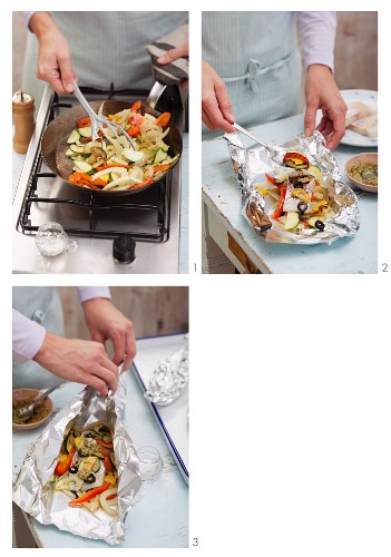 Steamed fish fillet with Mediterranean vegetables in aluminium foil being prepared