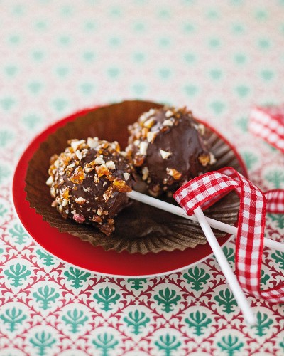 Cake pops with chocolate glaze and peanut brittle