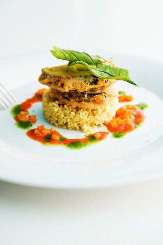 Aubergine piccata on a bed of rice with tomato sauce