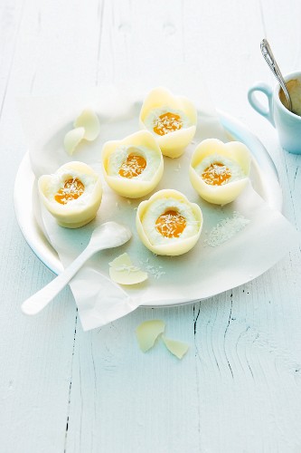 Faux mango eggs in white chocolate