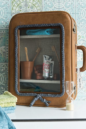 A bathroom cabinet made from an old suitcase
