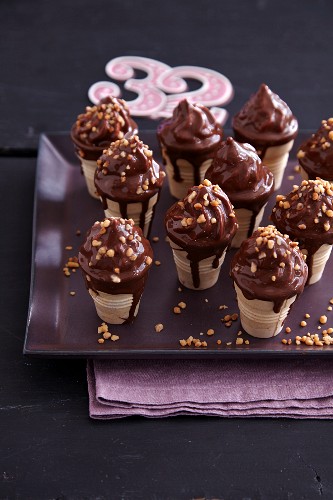 Homemade chocolate cones with brittle in cones