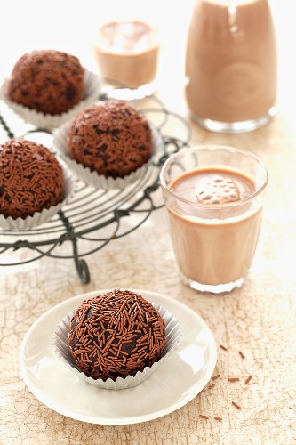 Chocolate nut truffles and glasses of cocoa