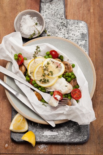 Cod fillet with vegetables in parchment paper