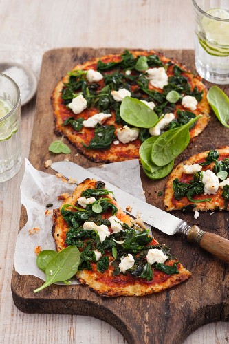 Vegetarian cauliflower pizza with spinach and ricotta