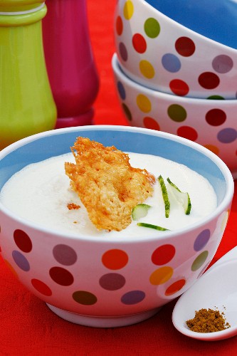Cold cucumber and yoghurt soup with a Parmesan wafer