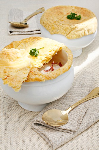 Broth with custard Royale and a puff pastry topping