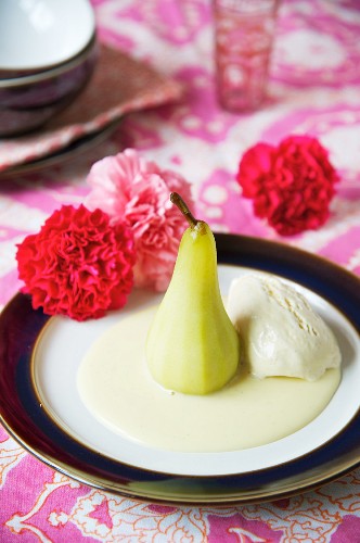 Poached pears with vanilla sauce and vanilla ice cream
