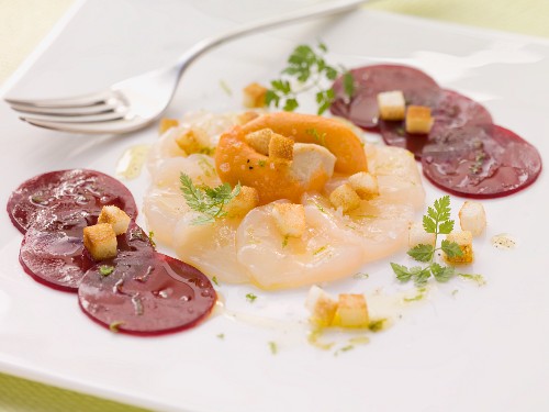 Scallop carpaccio with sliced beetroot
