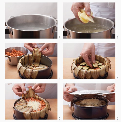 Preparing moussaka in a loose-bottomed tin