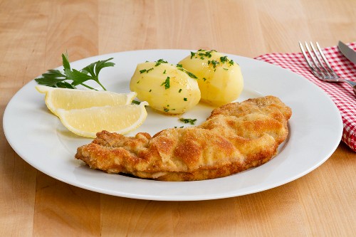 Wiener Schnitzel (breaded veal escalope) with parsley potatoes
