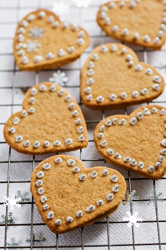 Heart-shaped cinnamon biscuits decorated with sugared beads