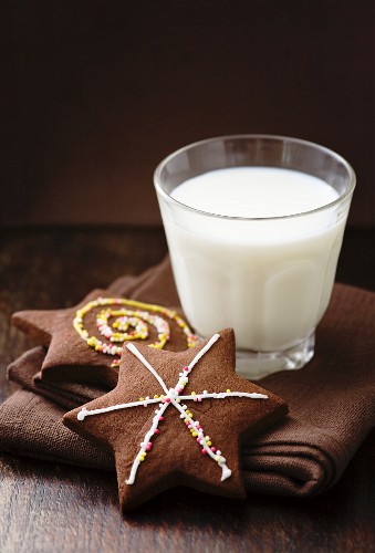 Two chocolate stars and a glass of milk