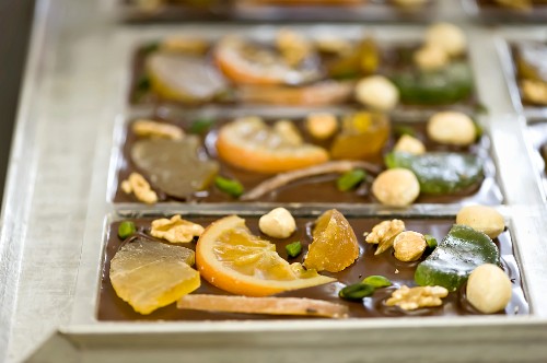 Bars of chocolate with candied fruits and nuts