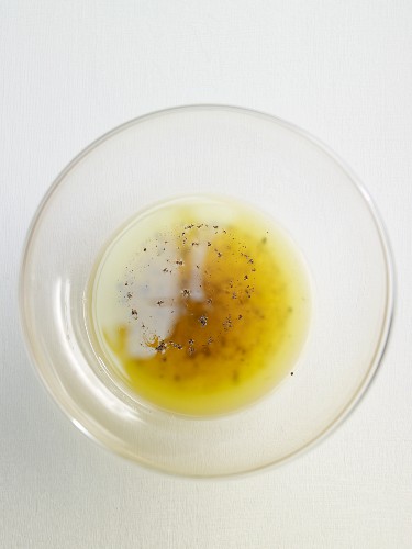 Lemon vinaigrette in a glass bowl