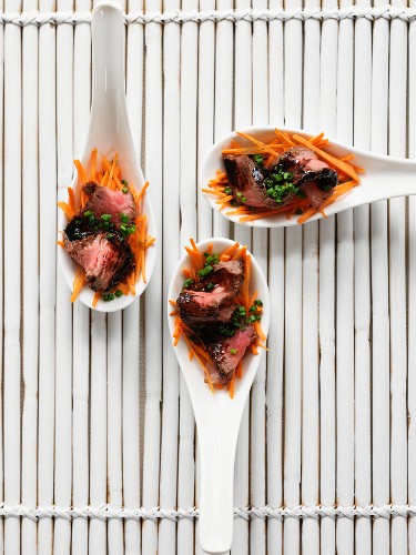 Spoon canapes with beef, balsamic vinegar and carrots