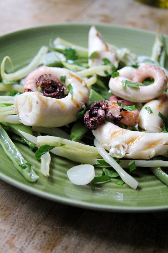 Grilled octopus on a bed of vegetables