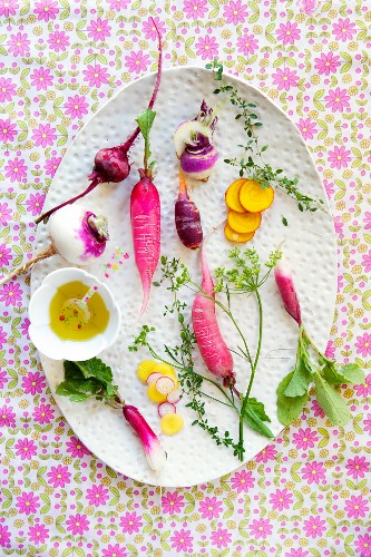 Various Root Vegetables on a White Platter; From Above