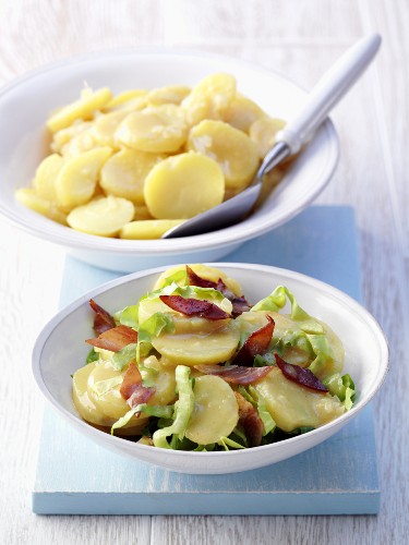 A potato salad with onions, and a potato salad with bacon strips