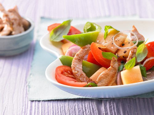 Pepper and melon salad with turkey breast strips