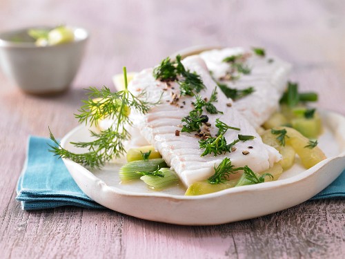 Steamed fillet of haddock on a bed of cucumber with dill yoghurt