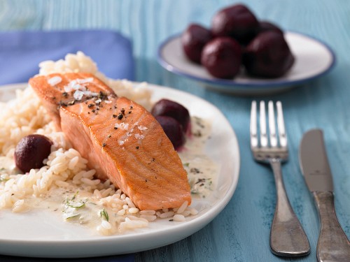 Pan-fried fillets of salmon in creamy mustard sauce with beetroot